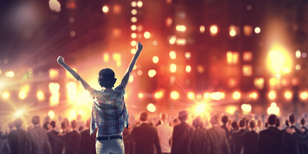 Back view of girl standing in stage lights.jpeg